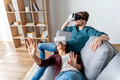 Man-woman-having-fun-home-with-virtual-reality-headset 23-2148956567.webp